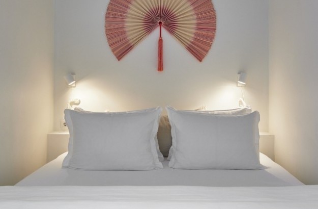 Cozy sleeping area with double bed and soft lighting in the one-bedroom apartment at Thingholt Apartments by Center Hotels in Reykjavik.