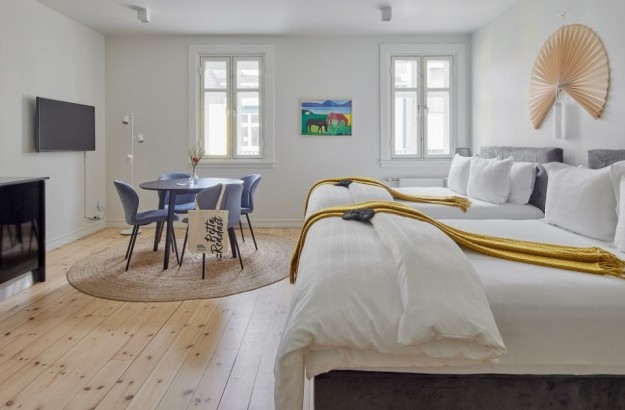 Family apartment with two double beds and a dining area at Thingholt apartments from Center Hotels in Reykjavik.