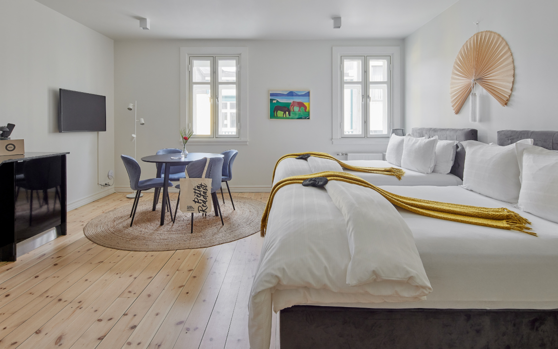Family apartment with two double beds and a dining area at Thingholt apartments from Center Hotels in Reykjavik.