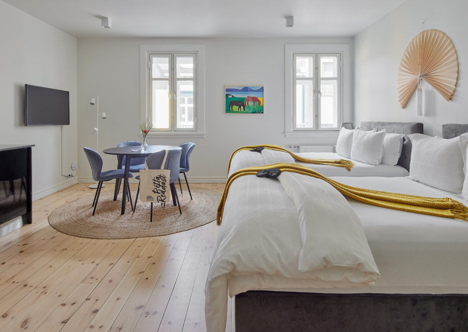 Family apartment with two double beds and a dining area at Thingholt apartments from Center Hotels in Reykjavik.