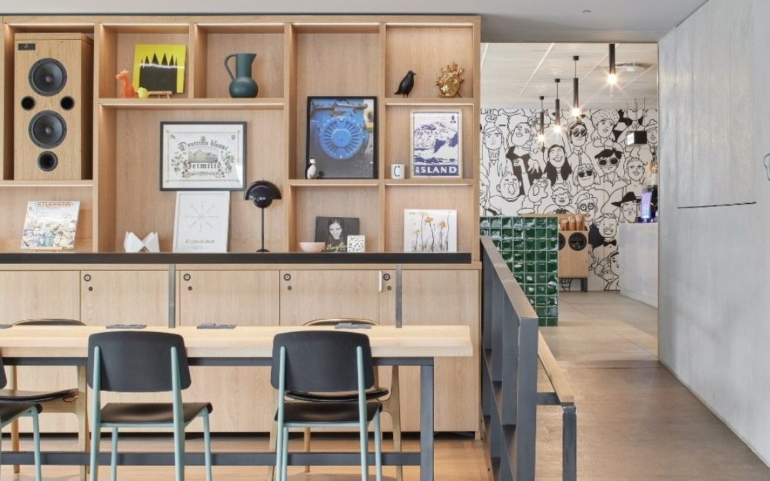 Artistic lobby at Center Hotels Laugavegur in Reykjavik. Features Icelandic artwork, illustration mural, and bold modern design.
