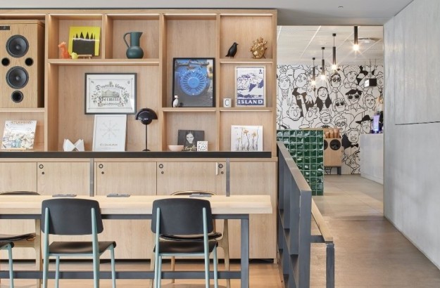 Artistic lobby at Center Hotels Laugavegur in Reykjavik. Features Icelandic artwork, illustration mural, and bold modern design.