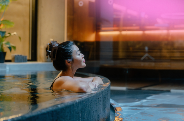 Woman relaxing in the hot tub at Grandi Spa