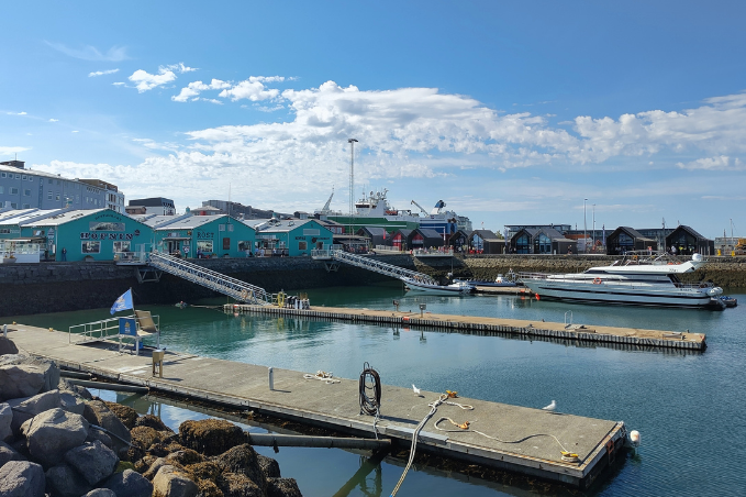 Boats and colorful buildings at Reykjavík’s Old Harbour on a sunny day.