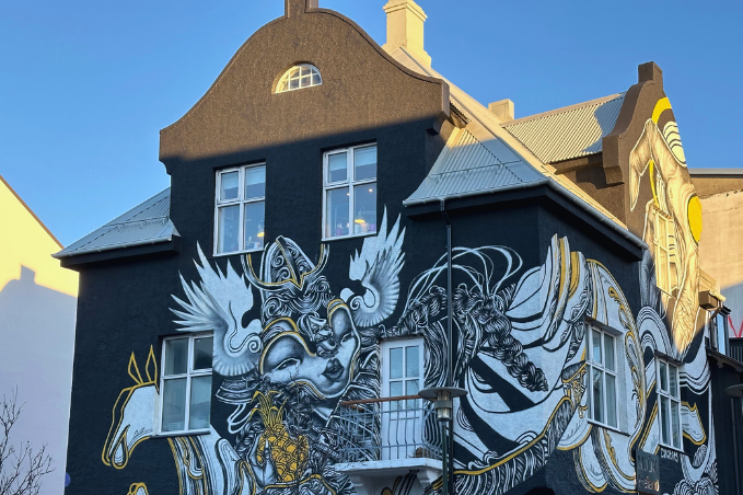 Large mural painted on the side of a building in central Reykjavík.