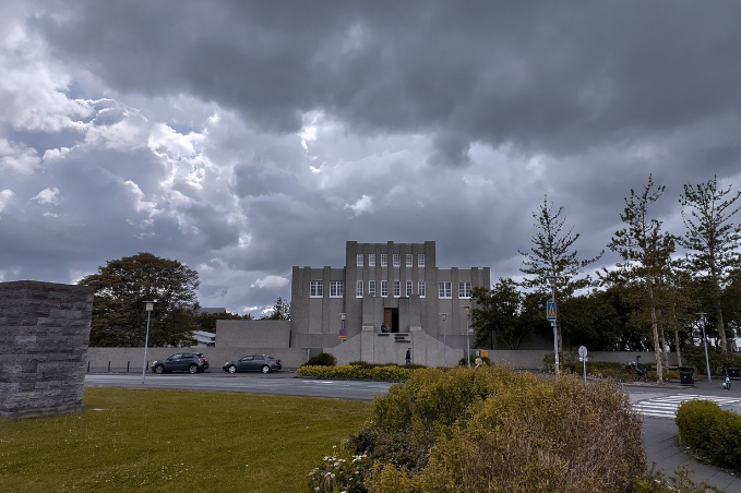 Einar Jónsson Museum in Reykjavík, with its grey façade beneath dramatic clouds and gardens in the foreground.