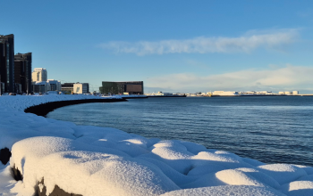 Snow-covered Reykjavík coastline on a clear winter day in February