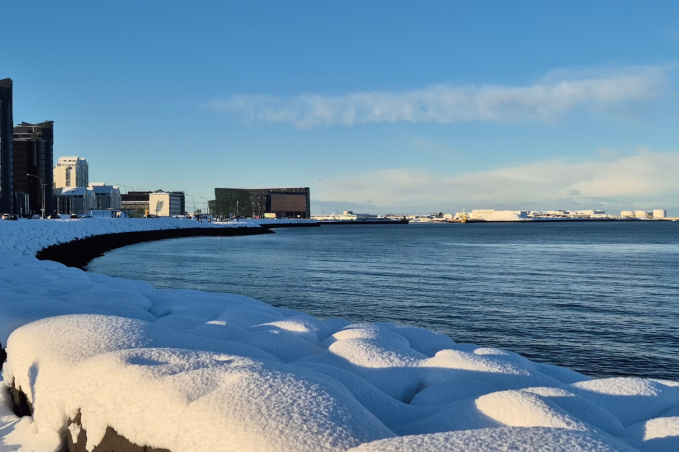 Snow-covered Reykjavík coastline on a clear winter day in February