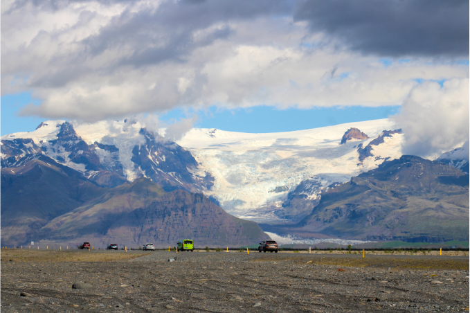 Cars driving toward Vatnajökull glacier in Iceland