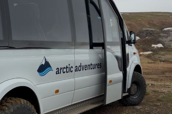 Arctic Adventures 4x4 vehicle parked in the Icelandic Highlands during a Landmannalaugar excursion.