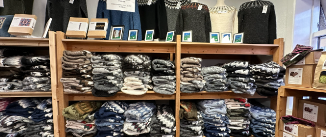 Wool sweaters in a store on laugavegur shopping street in reykjavik. Many different types of icelndic wool sweaters on shelves. 