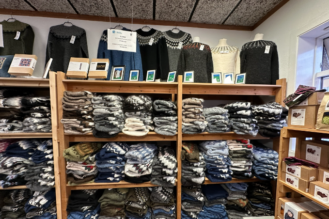 Wool sweaters in a store on laugavegur shopping street in reykjavik. Many different types of icelndic wool sweaters on shelves. 