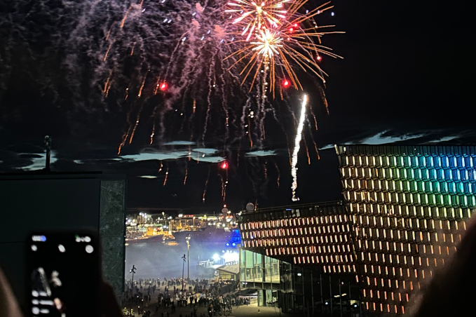 Fireworks lighting up the night sky over Harpa Concert Hall during Reykjavík Culture Night.