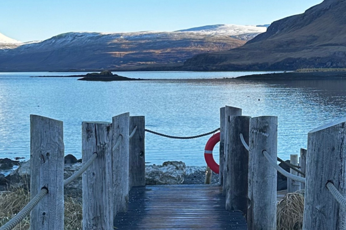 Ocean and mountain views at Hvammsvik Hot Springs in Iceland