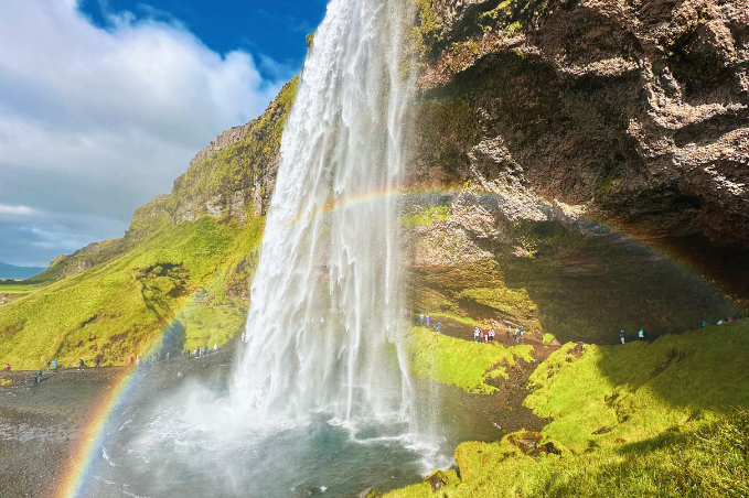 Seljalandsfoss waterfall with a rainbow on Iceland’s South Coas