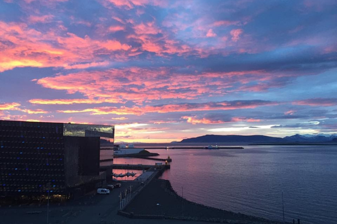 Colorful sunset over Harpa Concert Hall and Reykjavík harbour, Iceland