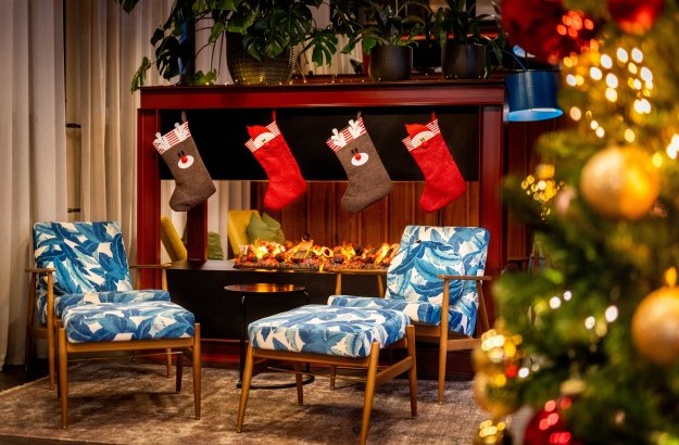 Christmas decorations in the lobby at Grandi by Center Hotels. Christmas lights and stocking by the fireplace.
